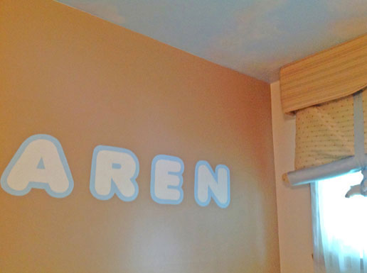 Baby fonts of circle soft edges with color reverse on a brown color - nursery room mural modern design, Montreal.